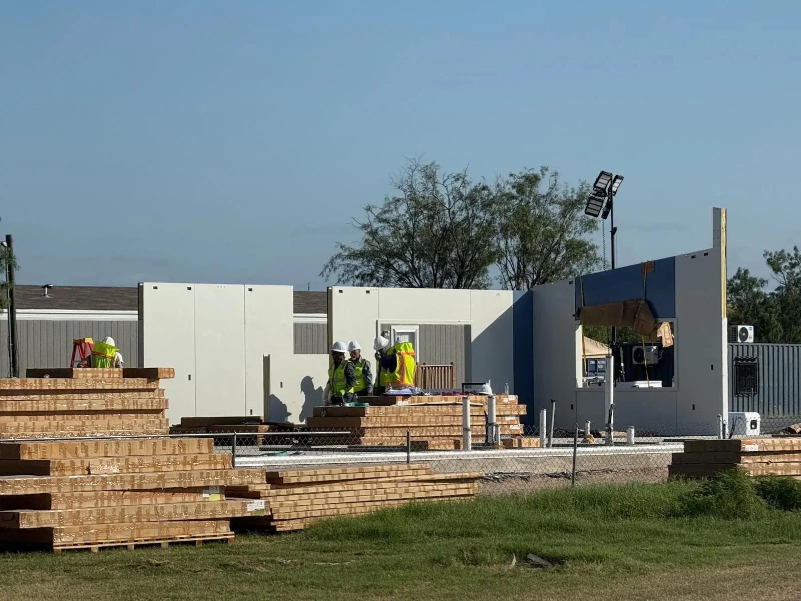 Crew assembling engineered wall panels for Zona Verde homes in Texas