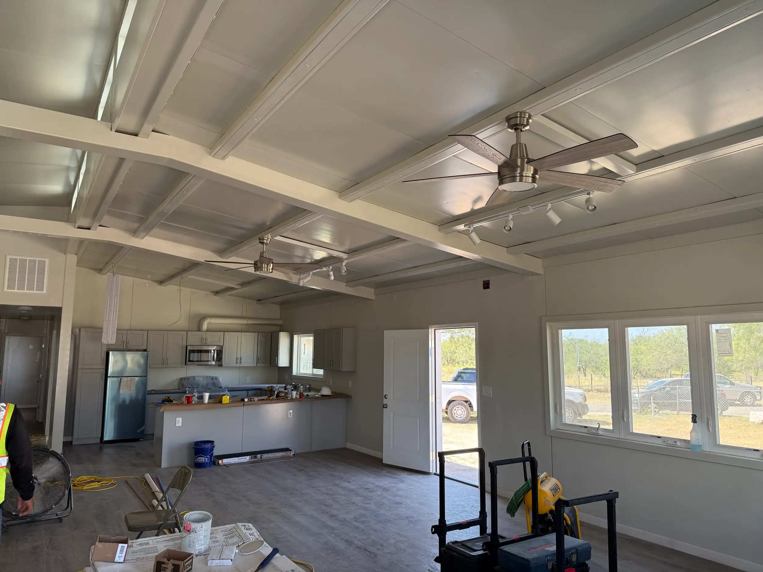 Great room interior with vaulted panel ceiling, in progress