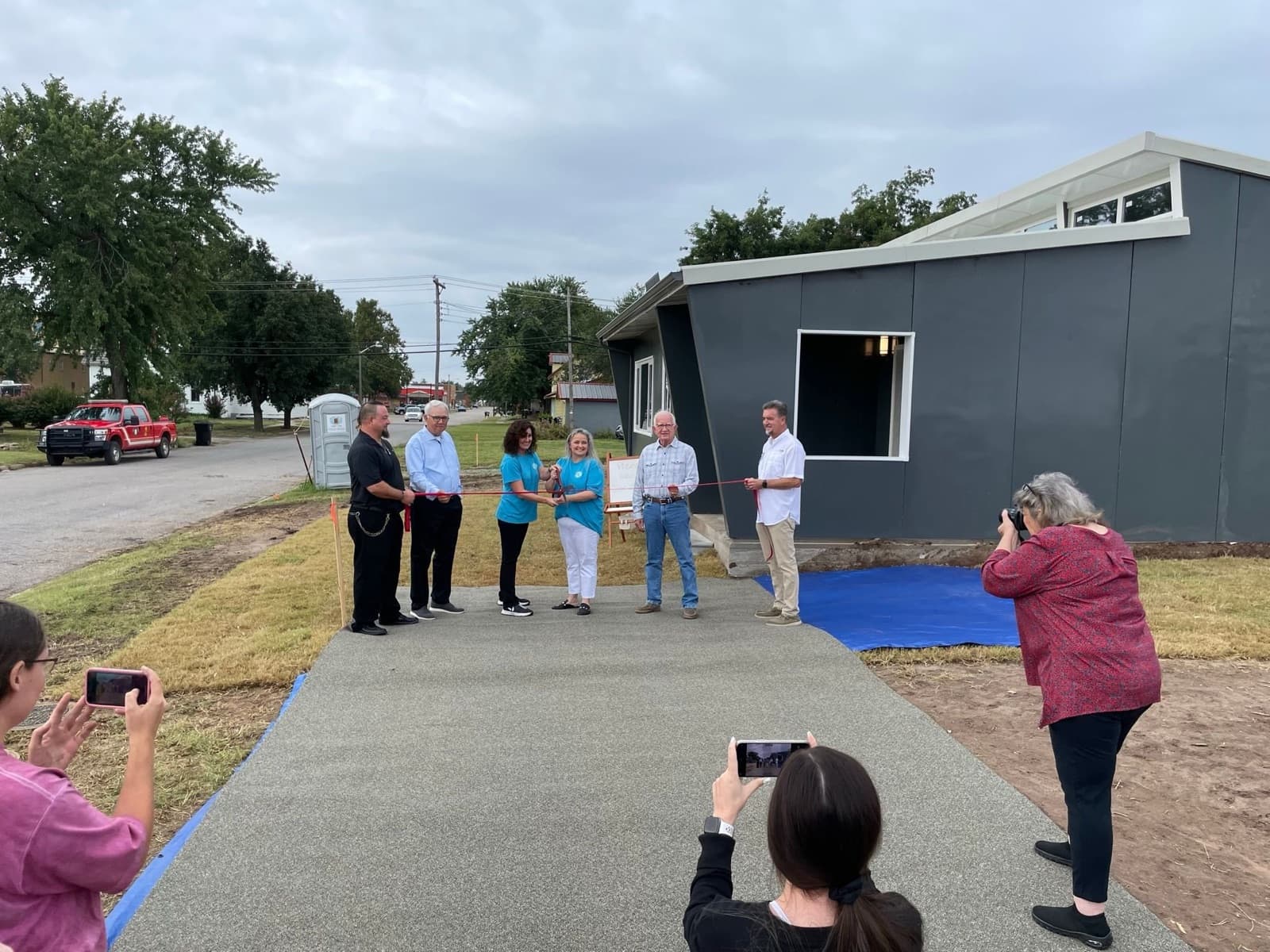 City officials and community members cutting the ribbon at the Watonga Zona Verde home, September 2023